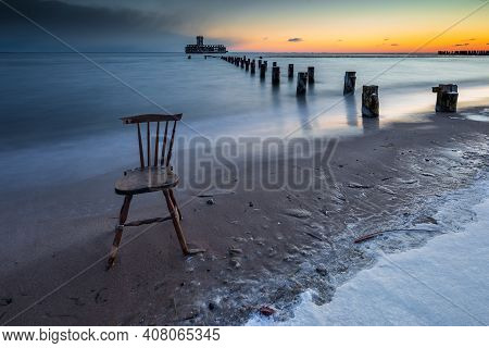 Gdynia, Poland - 06 February 2021: Winter Landscape At The Sea. Frozen Wooden Breakwaters Line To Th