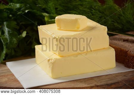 Butter. Slices Of Butter With Parsley And Bread