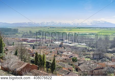 Ayllon Village View From The Top Of A Hill And In The Background, After The Sowing Fields, The Mount