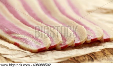 Raw Plant Based Vegan Bacon Pieces On Crumpled Paper