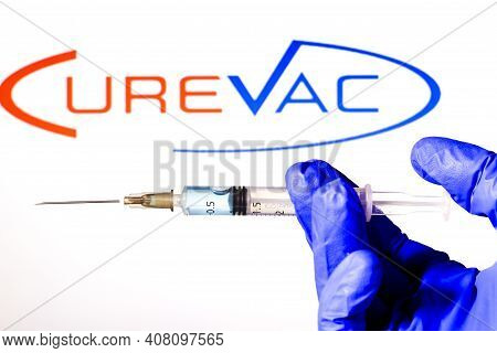 Madrid, Spain- February 3, 2020: Hand On White Surgery Glove Holding Syringe With Covid Vaccine. In 