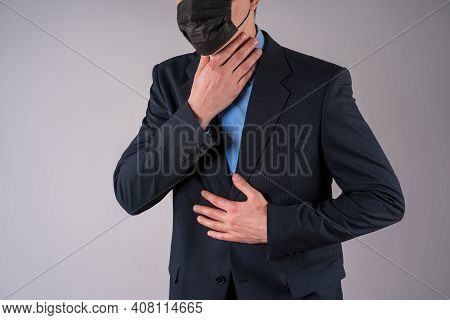 Office Worker With Coronavirus Symptoms On Gray Background
