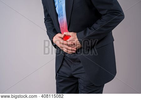 Office Worker With Abdominal Pain, Stomach Ache On Gray Background