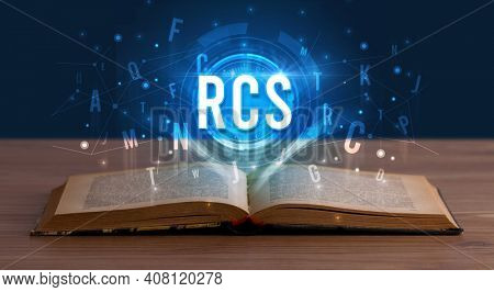 RCS inscription coming out from an open book, digital technology concept