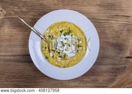 Kulesha - Hutsul Corn Porridge, Cooked On Water, Served With Cheese, Butter, Cheese And Sour Cream O