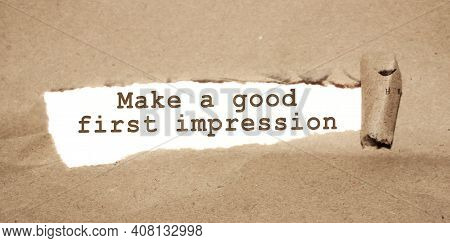 The Text Make A Good First Impression Appearing Behind Torn Brown Paper.