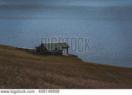 Bour Village Grass-covered Picturesque Houses At The Faroese Coastline In The Village Bour With View