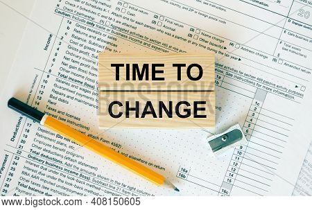 Wooden Blocks With Text Time To Change On Financial Docs