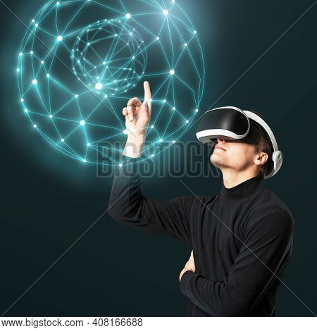 Man with VR pointing at holography globe