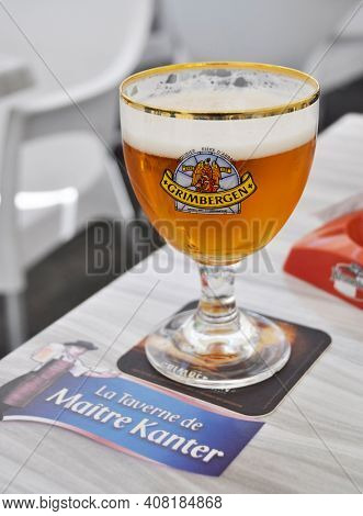 NANTES, FRANCE - CIRCA AUGUST 2011: A glass of Grimbergen beer served at La Taverne de Maitre Kanter