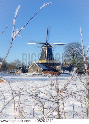 Pelmolen Ter Horst, Rijssen Netherlands During Snowy Weather Snow Covered Wind Mill In The Netherlan