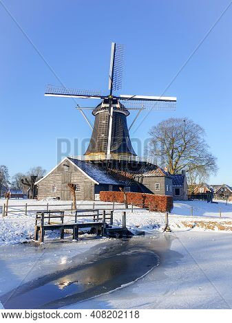 Pelmolen Ter Horst, Rijssen Netherlands During Snowy Weather Snow Covered Wind Mill In The Netherlan