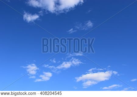 White Cloud In The Blue Sky. Blue Sky With Small White Clouds. Natural Background