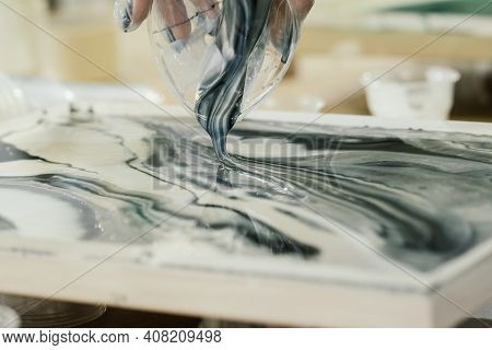 At The Fluid Art Workshop, Colored Resin Is Poured Onto Resin Art Painting