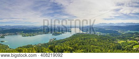 Aerial View Of The Alpine Lake Worthersee, Famous Tourist Attraction For Many Water Activity In Klag