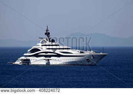 Luxury Yacht With Helipad And Helicopter Sailing In A Sea, Side View. White Futuristic Boat On Mount