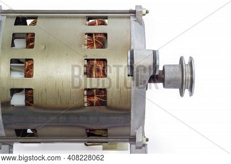 Fragment Of Electric Motor With  Pulley, Visible Windings In Ventilation Holes In The Housing And Sh