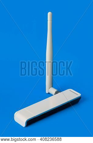 Wi-fi dongle receiver on blue background