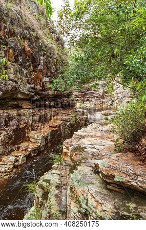 Sedimentary Rock Wall With A River Passing By The Rocks, Eco Tourism Landscape Of Capitólio Mg, Braz