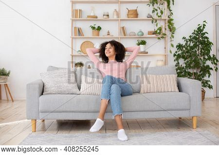 Cleanliness In Apartment, New Home And Positive Emotions. Smiling Young African American Lady Enjoyi
