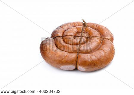 Smoked Sausage Twisted In A Spiral And Bound With A Beechnut, Isolated On A White Background.