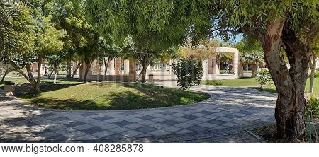 Manama, Bahrain - February 15 2021: Green Space With Palms And Other Local Plants In Al Andalus Gard