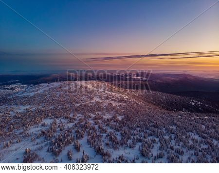 Colorful Winter Sunset In Sheregesh Ski Resort Mountains Covered Trees. Aerial Top View Beautiful Fo