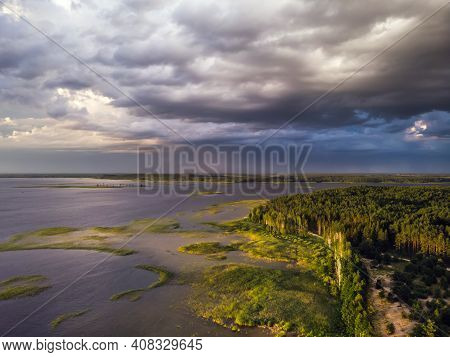 Stromy Clouds Over Eautful Peninsula Between Lakes Snudy And Strusto, National Park Braslau Lakes, B