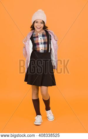 Welcome To School. Small Girl In Uniform. Cheerful Child Yellow Background. Beauty And Fashion For K