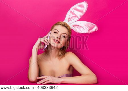 Easter Banny Woman Talking On Smartphone Isolated On Pink