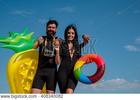 Summer Couple Vacation At Beach. Sexy Woman In Bikini. Summertime Concept. Sexy Man In Swimsuit. Sur