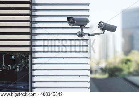 Security And Protection Concept With Outdoor Cctv Videocam On The Corner Of Modern Buisness Center. 