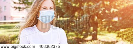 Young Woman Wearing Protective Mask Outdoors. Medicine Equipment. Pandemic Safety Concept. White T-s