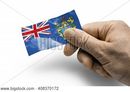 Hand Holding A Card With A National Flag The Pitcairn Islands