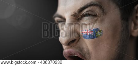 A Screaming Man With The Image Of The Pitcairn Islands National Flag On His Face