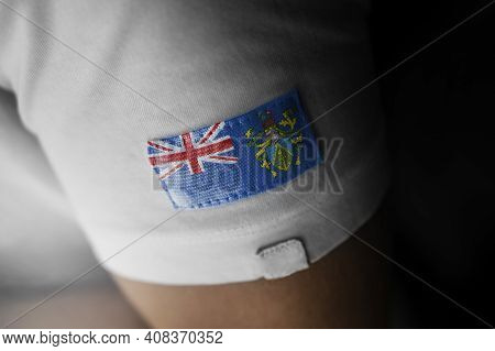 Patch Of The National Flag Of The Pitcairn Islands On A White T-shirt