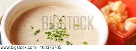 Creamy Onion Soup With Green. Health Food At Cafe. Classic Cuisine. Cooking Bowl With Bread Croutons