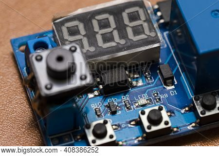 Macro Shot Of Plugged-in Printed Circuit Board With Three Digits Display And Surface Mounted Compone