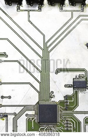 Macro Shoot Of Used Printed Circuit Board With Integrated Circuits And Metallization Circuitry For S