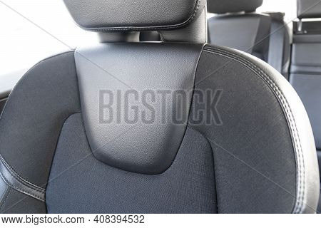 Modern Luxury Car Black Leather Interior. Part Of Perforated Leather Car Seat Details With White Sti