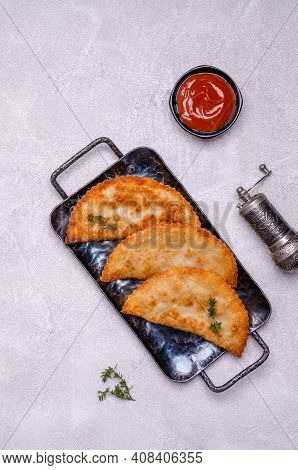 Fried Burekas With Filling On A Light Stone Background. Top View. Selective Focus.