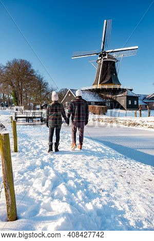 Pelmolen Ter Horst, Rijssen Covered In A Snowy Landscape Overijssel Netherlands, Historical Wind Mil