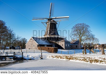 Pelmolen Ter Horst, Rijssen Covered In Snowy Landscape In Overijssel Netherlands, Historical Wind Mi