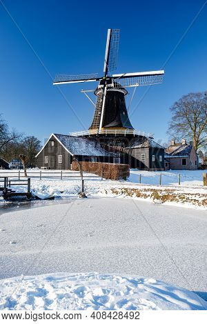 Pelmolen Ter Horst, Rijssen Covered In Snowy Landscape In Overijssel Netherlands, Historical Wind Mi