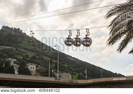 Haifa, Israel, February 13, 2021 : Cable Car Cabins Move From The Lower Station On The Waterfront To
