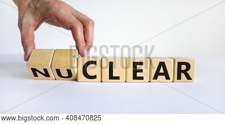 Nuclear Or Clear Symbol. Businessman Turns A Cube And Changes The Word 'nuclear' To 'clear'. Beautif