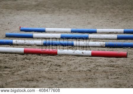 Colorful Barriers On The Ground For Jumping Horses And Riders At Riding School As A Background.obsta