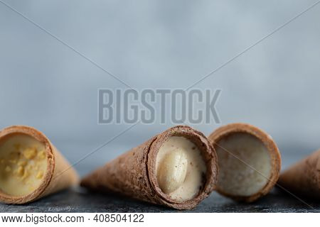 Tifferent Kinds Sweet Conus Candies On Grey Background. Close Up Photo