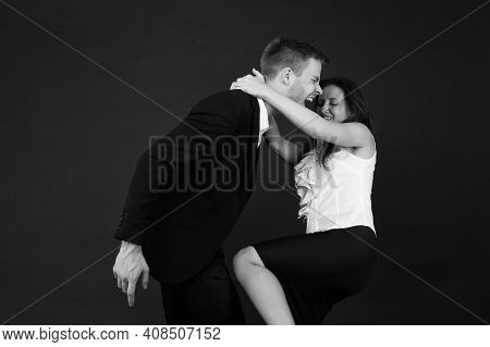 Violent Woman In Formal Wear Kneed Businessman In Groin Dark Background, Violence.