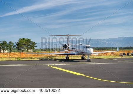 Small Airplane Parked On Airport. Use Of Private Jets To Avoid Coronavirus Risk And Restrictions. Di
